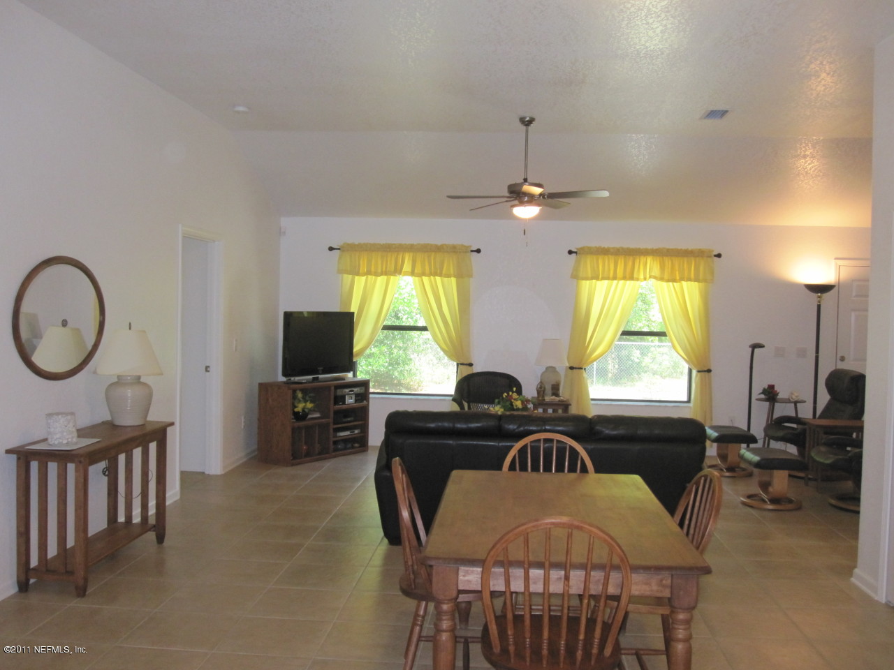 12589 Knotah Road Jacksonville, FL 32258 - Photo 10 of 25 a view of a livingroom with furniture window and wooden floor