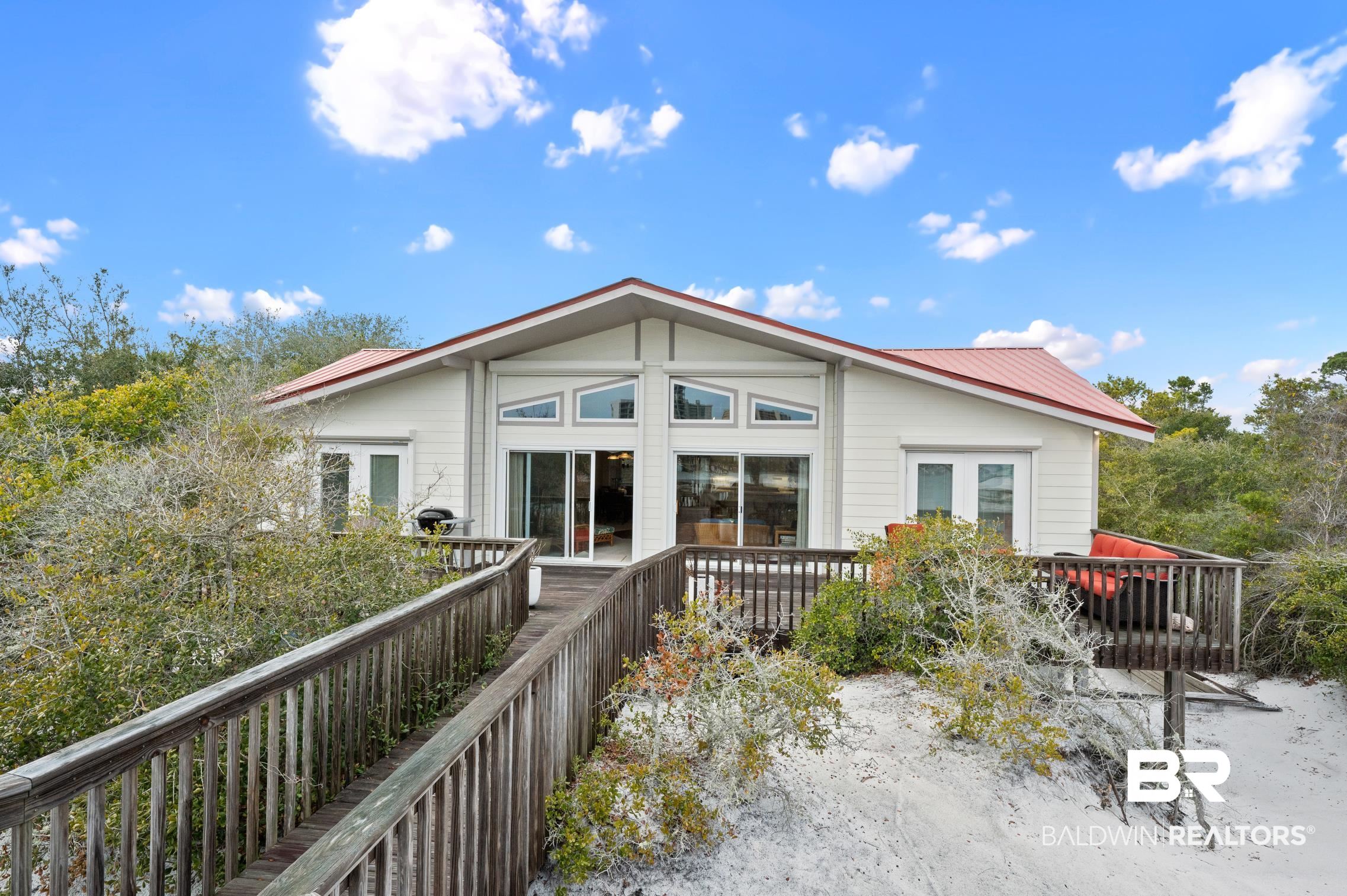 30388 River Road Orange Beach, AL 36561 - Photo 40 of 72 Rear view of property featuring metal roof