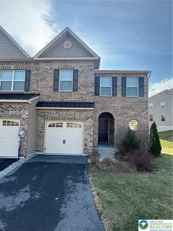 a front view of a house with yard