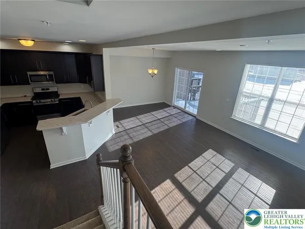 a kitchen with a sink a stove and refrigerator