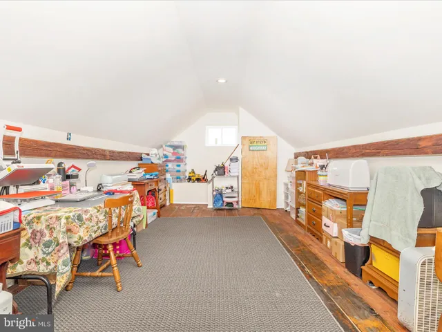 a view of a house with swimming pool and sitting area