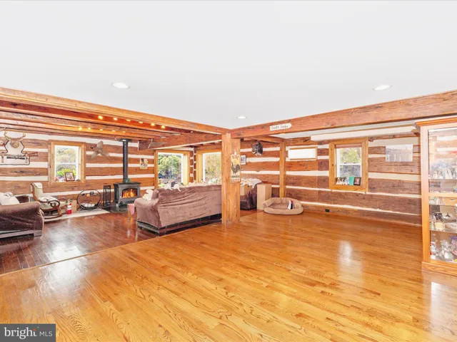 a living room with furniture fireplace and a flat screen tv