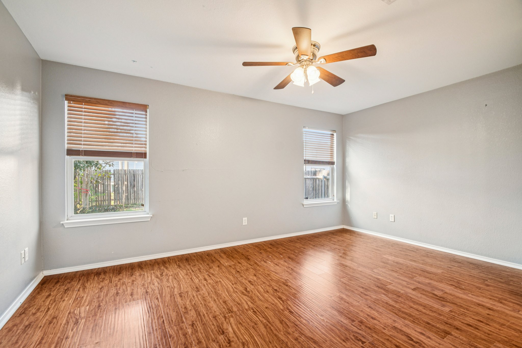 100 Kendall Cove Elgin, TX 78621 - Photo 15 of 31 a view of an empty room with wooden floor and a window