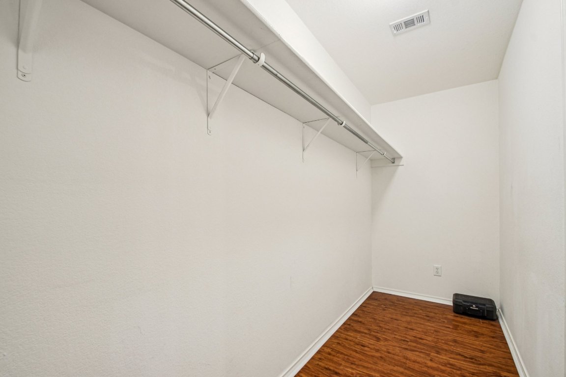 100 Kendall Cove Elgin, TX 78621 - Photo 20 of 31 a view of a room with racks on the wall