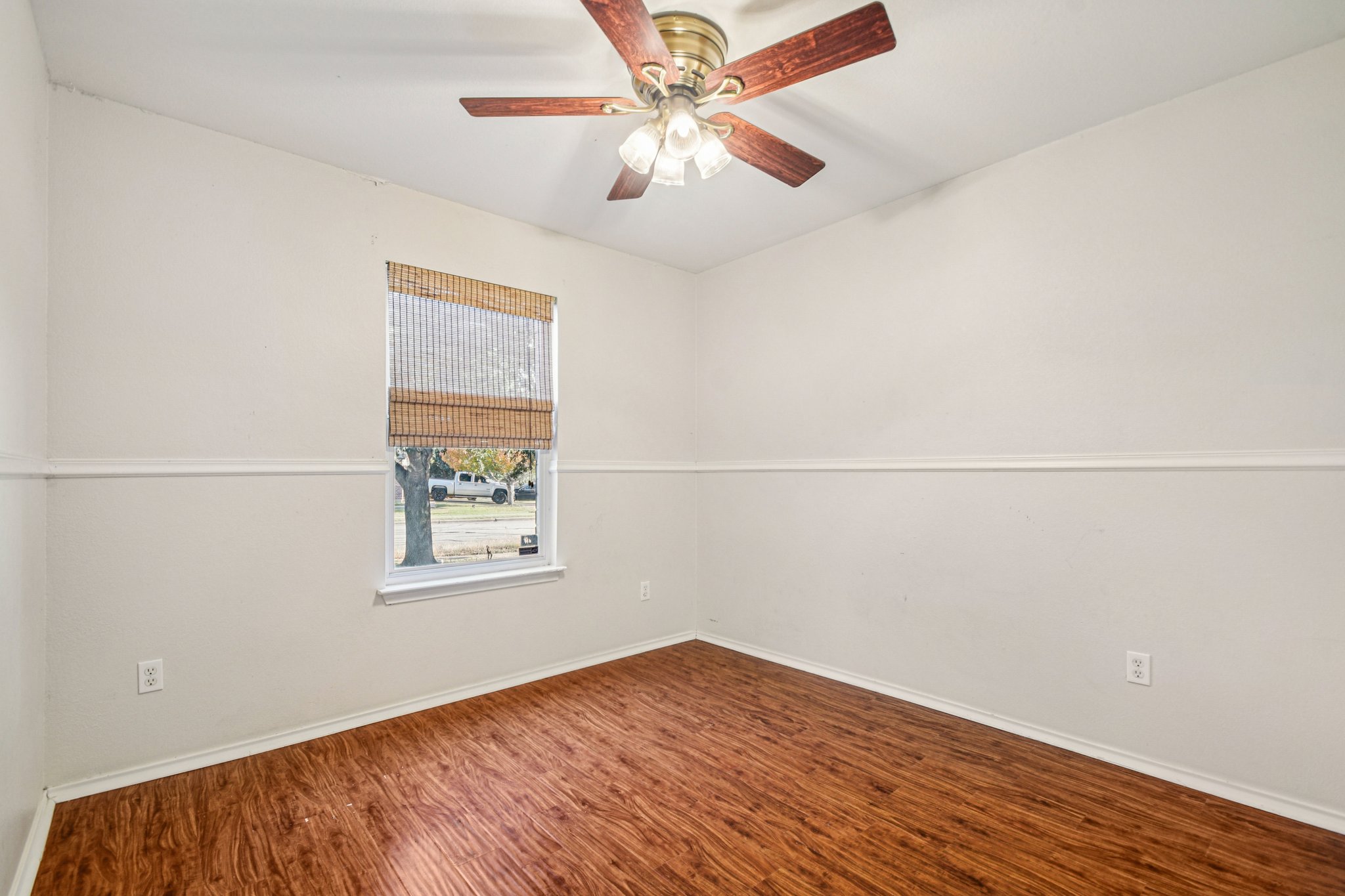 100 Kendall Cove Elgin, TX 78621 - Photo 22 of 31 an empty room with a window and a ceiling fan
