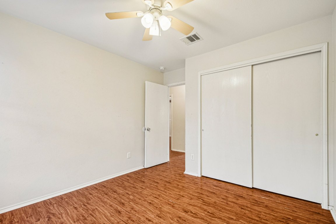 100 Kendall Cove Elgin, TX 78621 - Photo 23 of 31 a view of an empty room with wooden floor