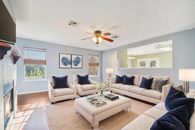 a living room with furniture and a large window