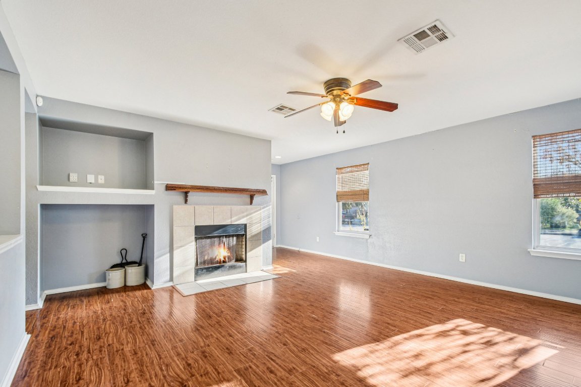 100 Kendall Cove Elgin, TX 78621 - Photo 9 of 31 a living room with furniture and a fireplace
