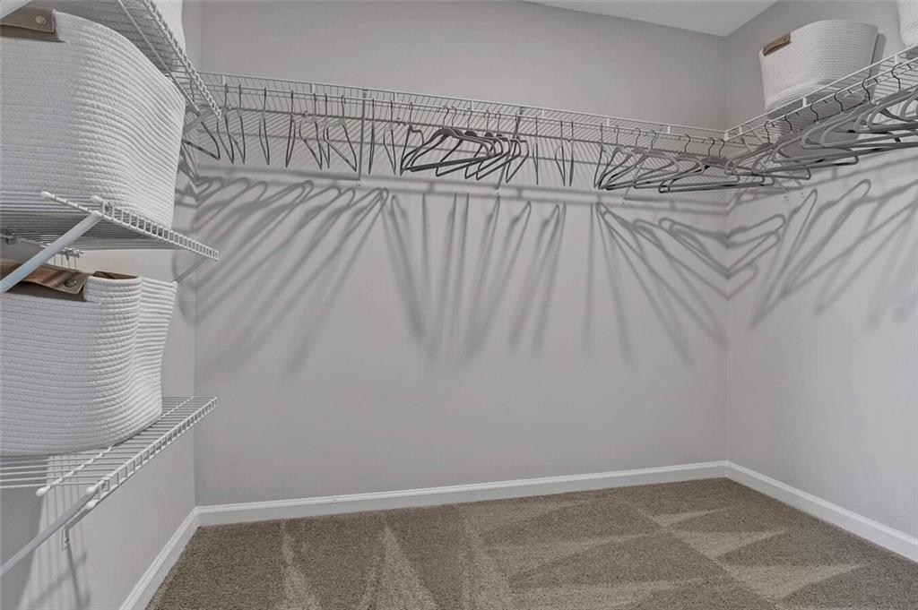 10 American Avenue, Unit ANISE Newnan, GA 30263 - Photo 17 of 47 a view of a room with racks on the wall