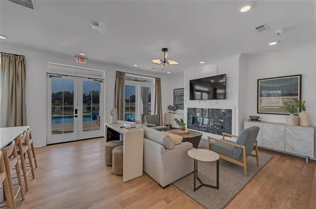 a large kitchen with lots of counter space dining table and a chandelier