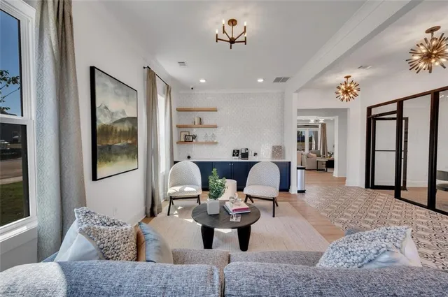 a view of a living room and balcony