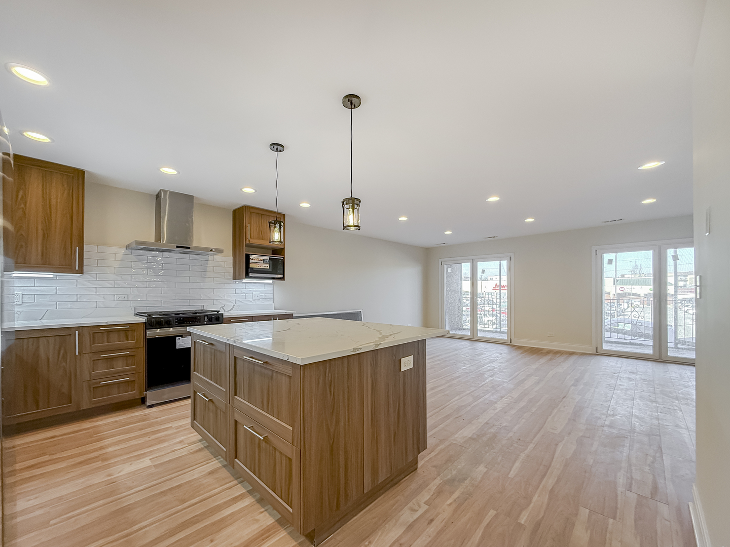 6415 West Irving Park Road, Unit 2N Chicago, IL 60634 - Photo 2 of 16 a kitchen with a sink and wooden floor