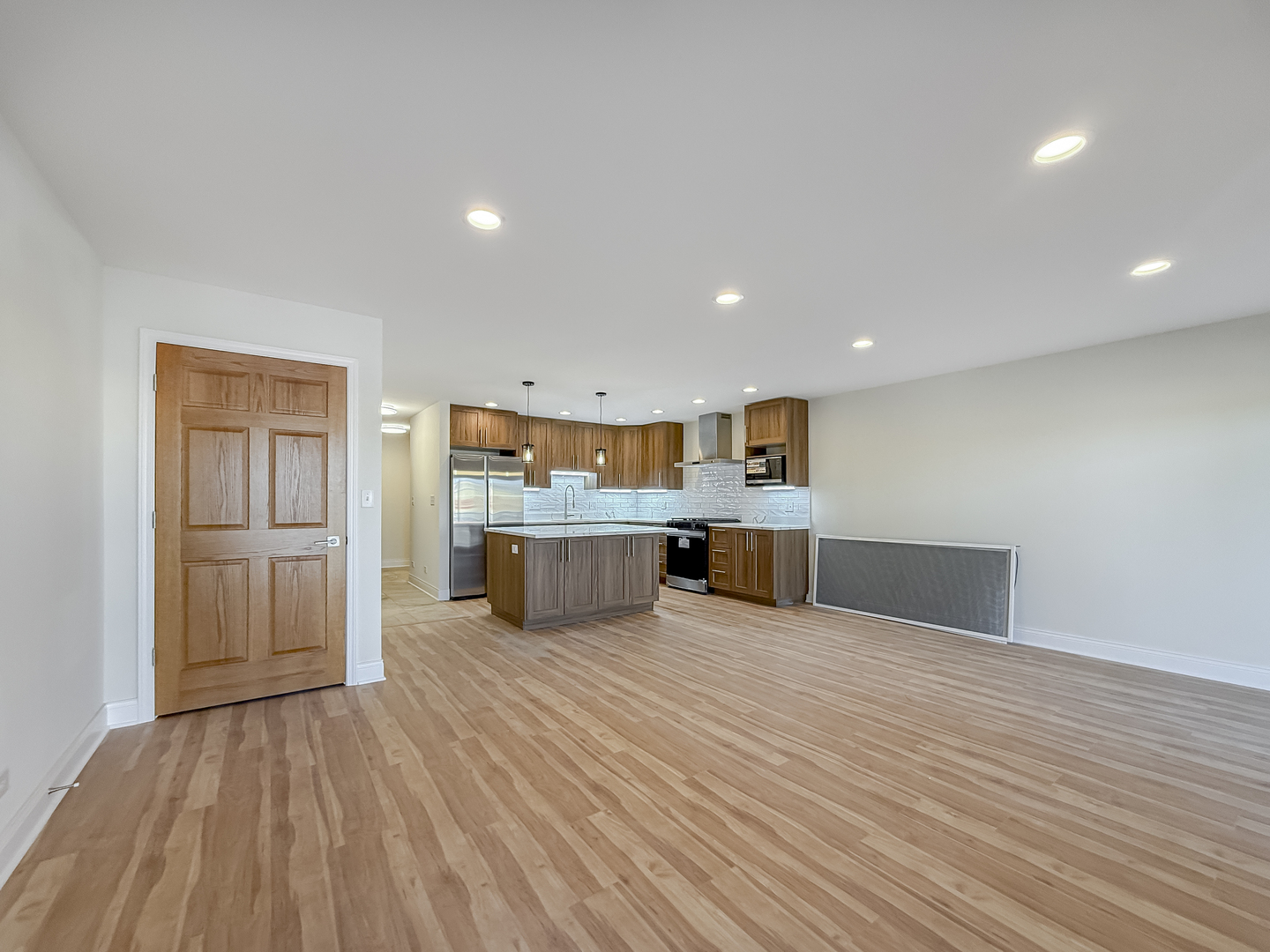 6415 West Irving Park Road, Unit 2N Chicago, IL 60634 - Photo 6 of 16 a view of kitchen with wooden floor