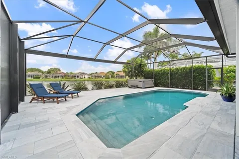 a view of a swimming pool with a patio