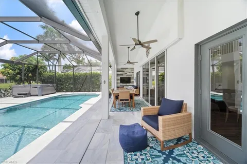 a view of a patio with couches table and chairs