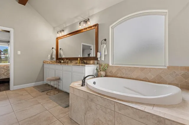 a bathroom with a sink and shower