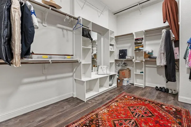 a bathroom with a granite countertop sink toilet and a mirror