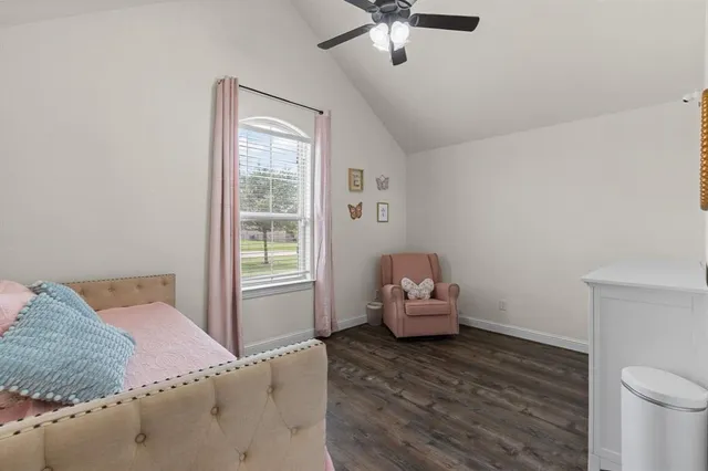 a bed room with a bed and a chandelier