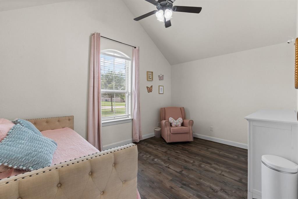 9708 Puma Trail Godley, TX 76044 - Photo 24 of 40 a bedroom with a bed and wooden floor