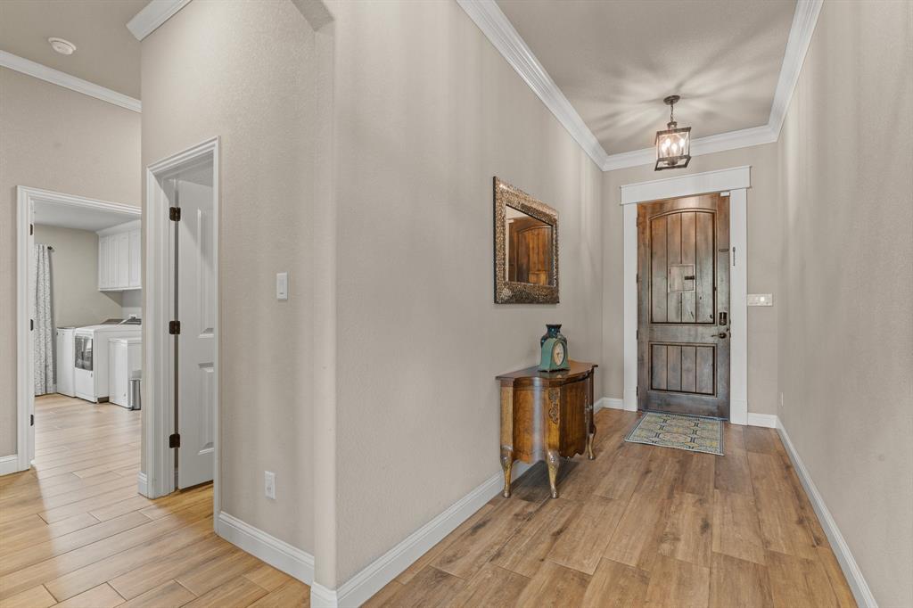 9708 Puma Trail Godley, TX 76044 - Photo 4 of 40 a view of a hallway view with wooden floor and staircase