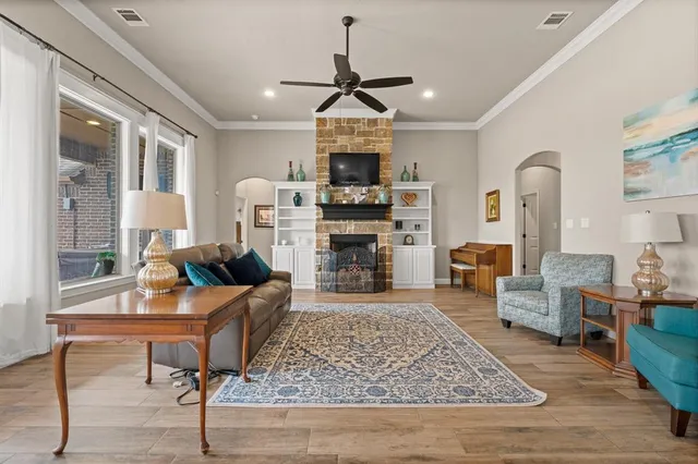 a living room with furniture and a fireplace