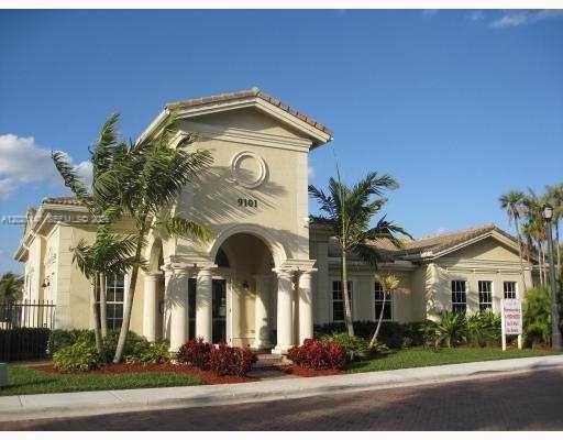 5930 Abbey Road Tamarac, FL 33321 - Photo 18 of 26 a front view of a house with a yard