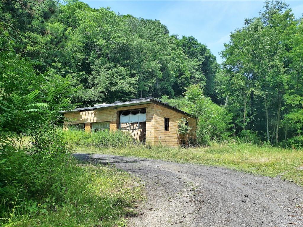 1439 Sharon Road New Brighton, PA 15066 - Photo 12 of 33 a front view of a house with yard and green space