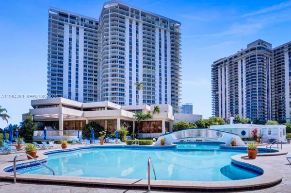 a view of swimming pool with outdoor seating