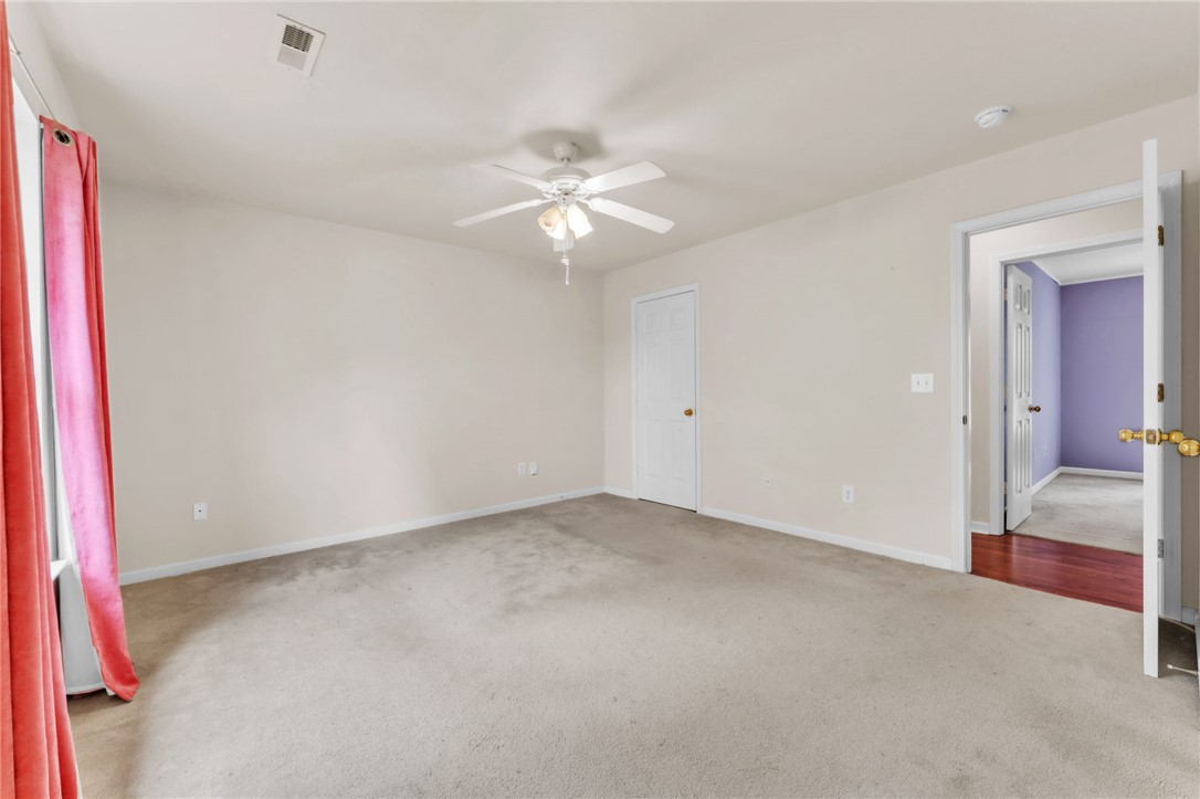 1816 Marchbanks Avenue Anderson, SC 29621 - Photo 12 of 31 This spacious room offers comfort and versatility, featuring a ceiling fan for year-round enjoyment.