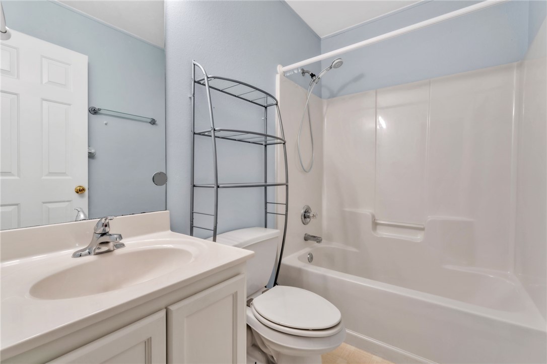 1816 Marchbanks Avenue Anderson, SC 29621 - Photo 19 of 31 This bright bathroom features a vanity, mirror, toilet, and a combined shower and tub.