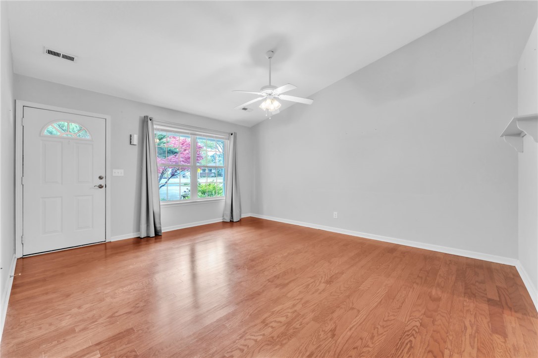 1816 Marchbanks Avenue Anderson, SC 29621 - Photo 6 of 31 This airy living space features lustrous floors, a bright window, and a soaring vaulted ceiling.