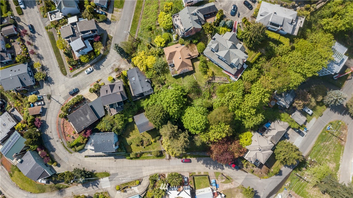 1701 41st Avenue Southwest Seattle, WA 98116 - Photo 13 of 21 an aerial view of a house with a yard and garden