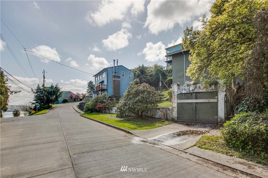 1701 41st Avenue Southwest Seattle, WA 98116 - Photo 6 of 21 a view of a house with a yard and potted plants