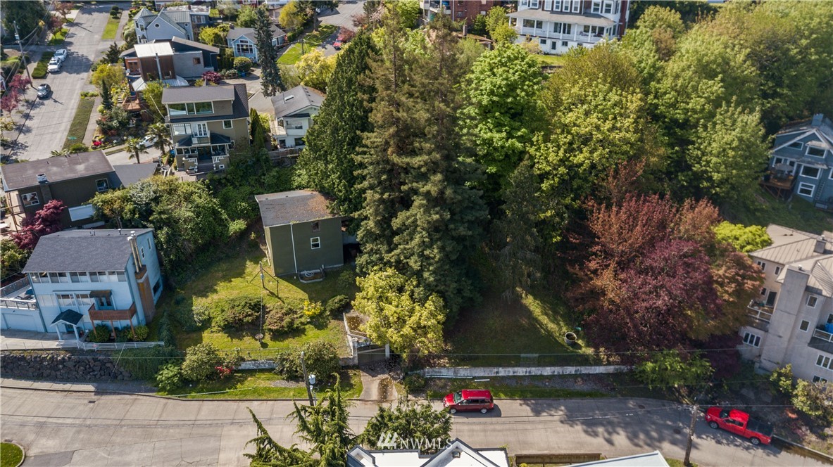 1701 41st Avenue Southwest Seattle, WA 98116 - Photo 8 of 21 an aerial view of a house with a yard and a fountain