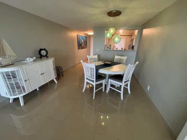 a bathroom with a mirror a sink and a window
