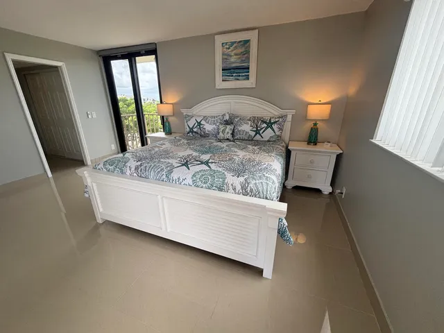 a bedroom with a bed and dresser