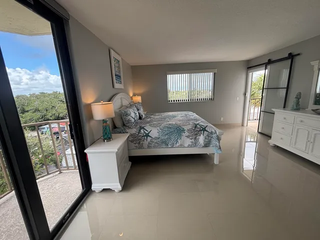 a bathroom with a double vanity sink toilet and shower