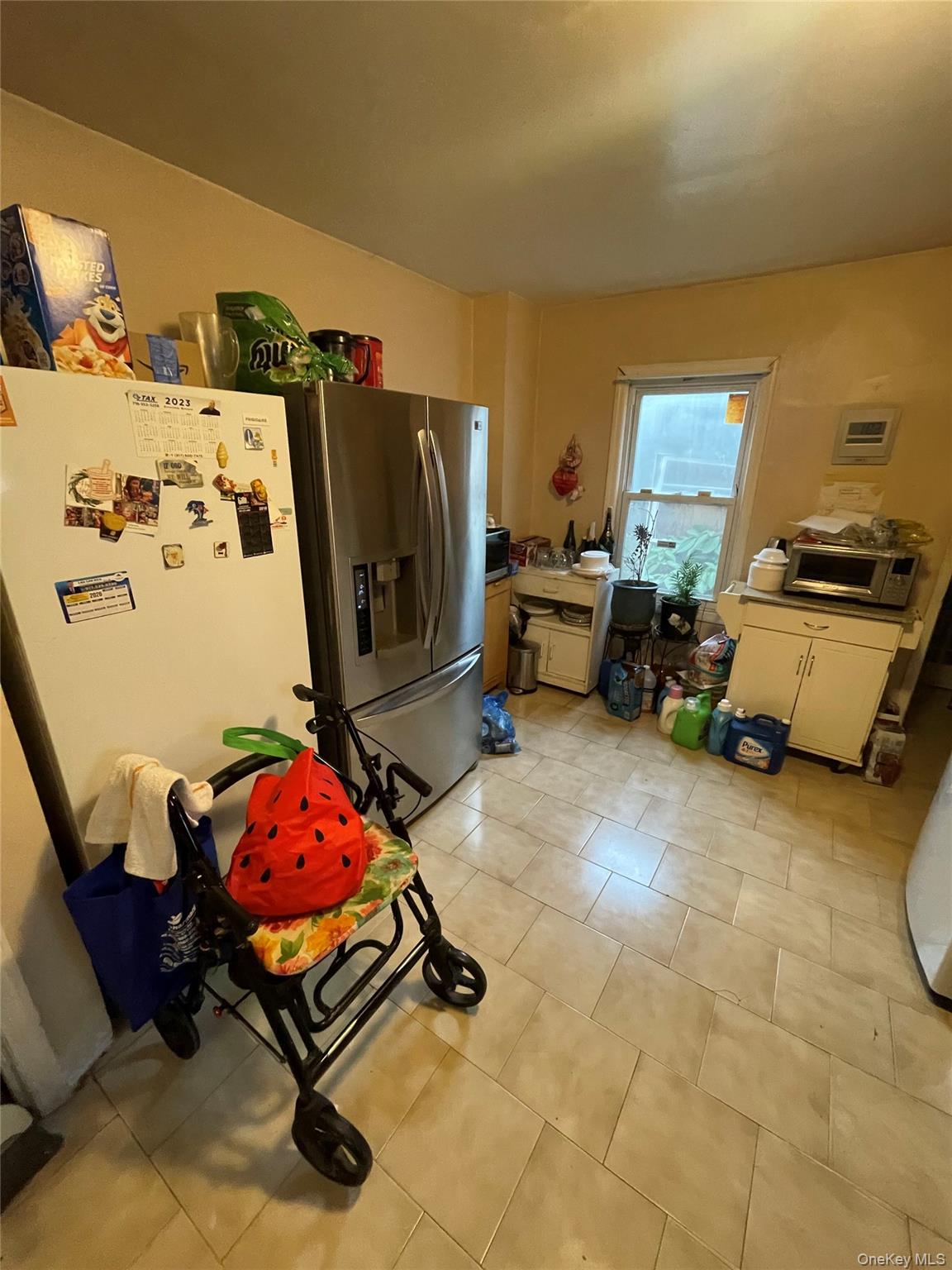 106-20 109th Avenue Queens, NY 11417 - Photo 2 of 12 Kitchen featuring stainless steel refrigerator with ice dispenser