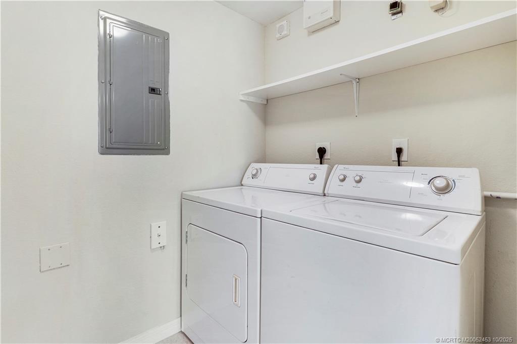 110 Southwest Peacock Boulevard, Unit 6104 Port St. Lucie, FL 34986 - Photo 23 of 27 a utility room with dryer and washer