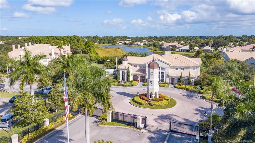 110 Southwest Peacock Boulevard, Unit 6104 Port St. Lucie, FL 34986 - Photo 25 of 27 an aerial view of a house with outdoor space and lake view