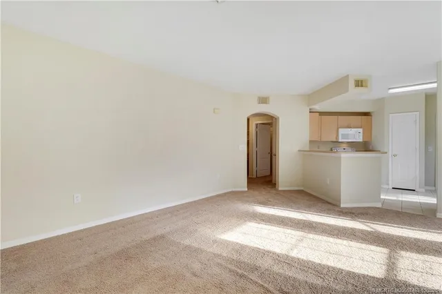 a view of a kitchen with a sink and cabinets