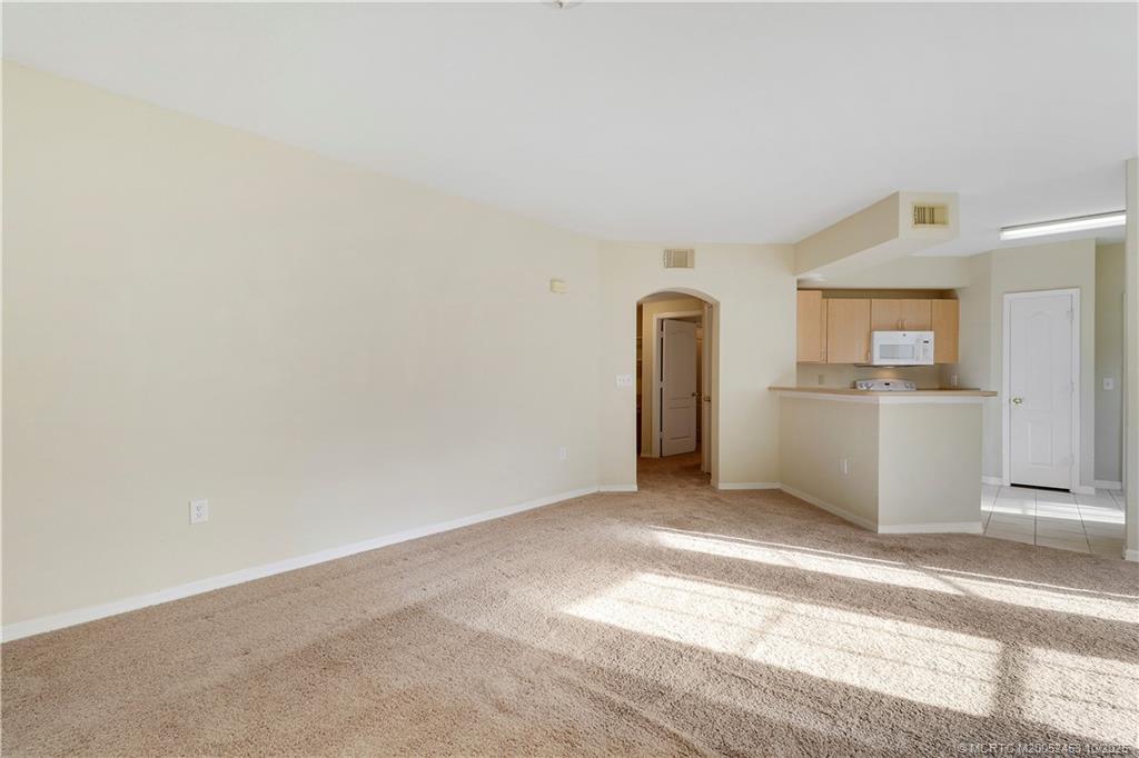 110 Southwest Peacock Boulevard, Unit 6104 Port St. Lucie, FL 34986 - Photo 3 of 27 a view of a kitchen with a sink and cabinets