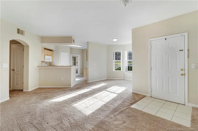 a view of a kitchen with a sink and a window