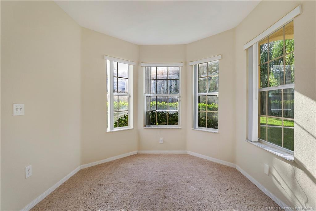 110 Southwest Peacock Boulevard, Unit 6104 Port St. Lucie, FL 34986 - Photo 6 of 27 an empty room with a window