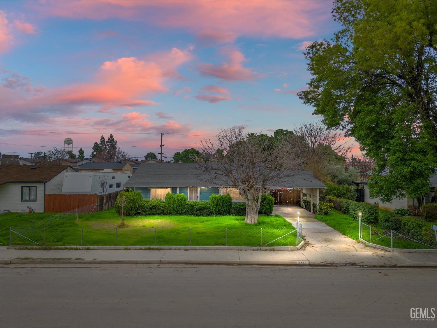 Undisclosed Address Bakersfield, CA 93308 - Photo 1 of 50 a view of a street with a houses