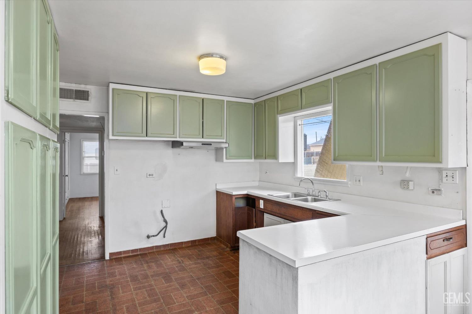 Undisclosed Address Bakersfield, CA 93308 - Photo 14 of 50 a bathroom with a sink and a mirror
