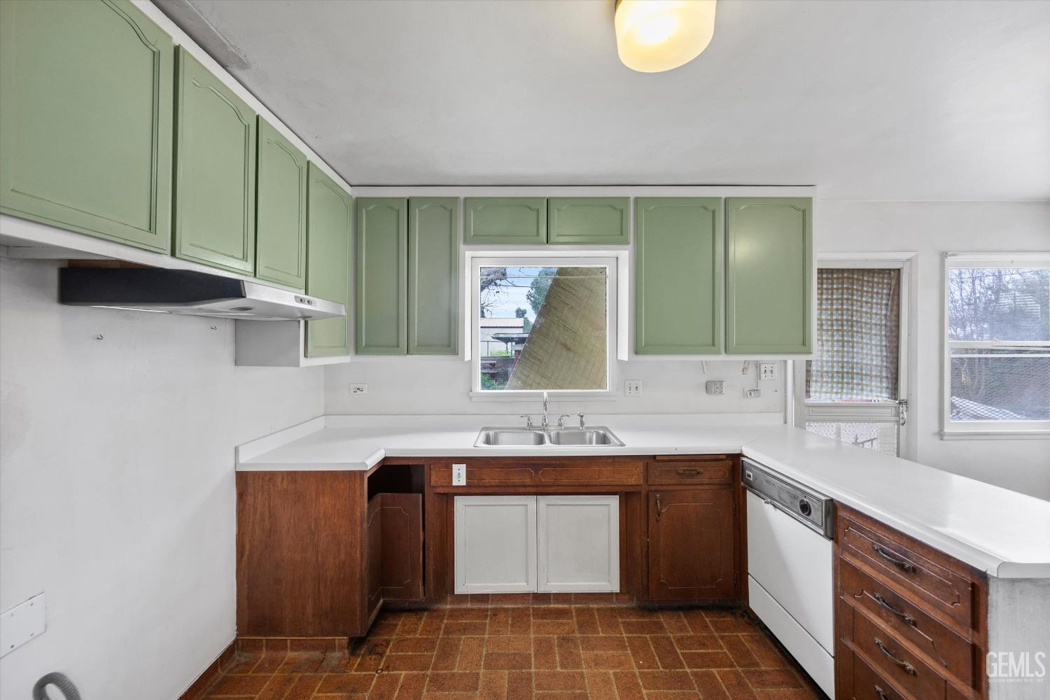 Undisclosed Address Bakersfield, CA 93308 - Photo 15 of 50 a bathroom with a double vanity sink and a mirror