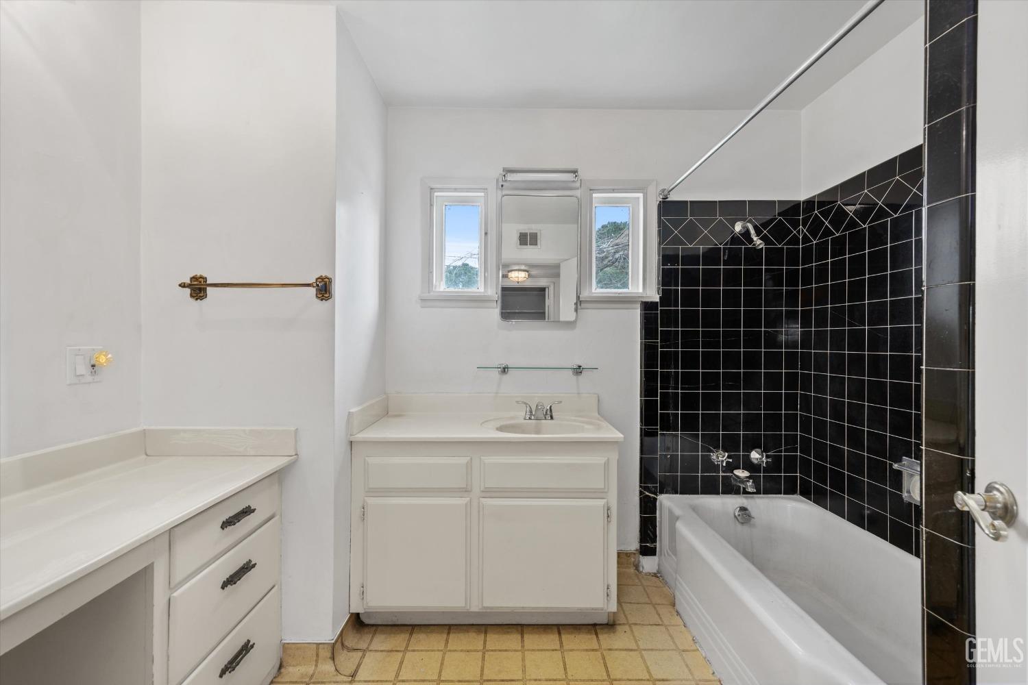 Undisclosed Address Bakersfield, CA 93308 - Photo 17 of 50 a bathroom with a sink a toilet and shower