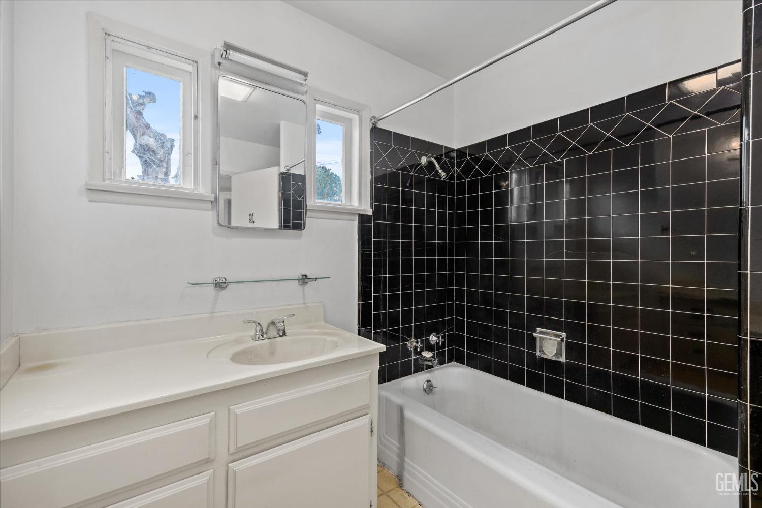 Undisclosed Address Bakersfield, CA 93308 - Photo 18 of 50 a bathroom with a sink toilet vanity and bathtub