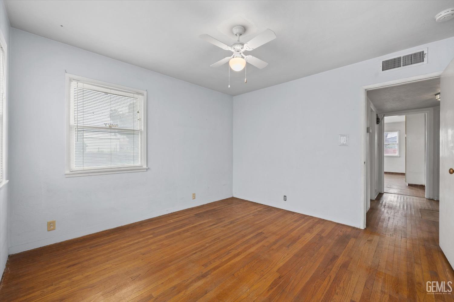 Undisclosed Address Bakersfield, CA 93308 - Photo 22 of 50 a view of an empty room with wooden floor